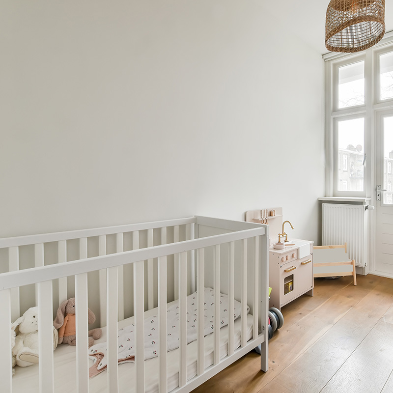 Interior of a cozy children's room in white color and themed design